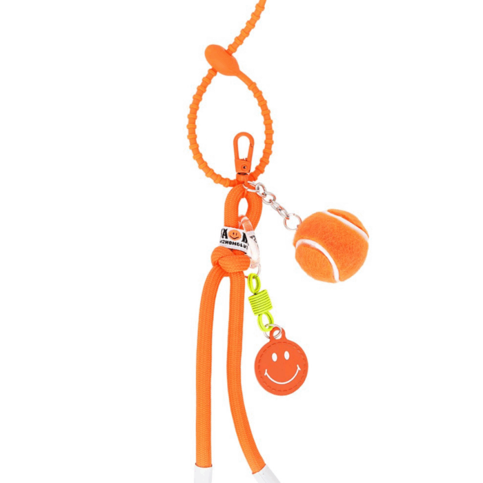 Bag charm με πορτοκαλί μπαλάκι τένις και smiley από το Mandarin Jewels